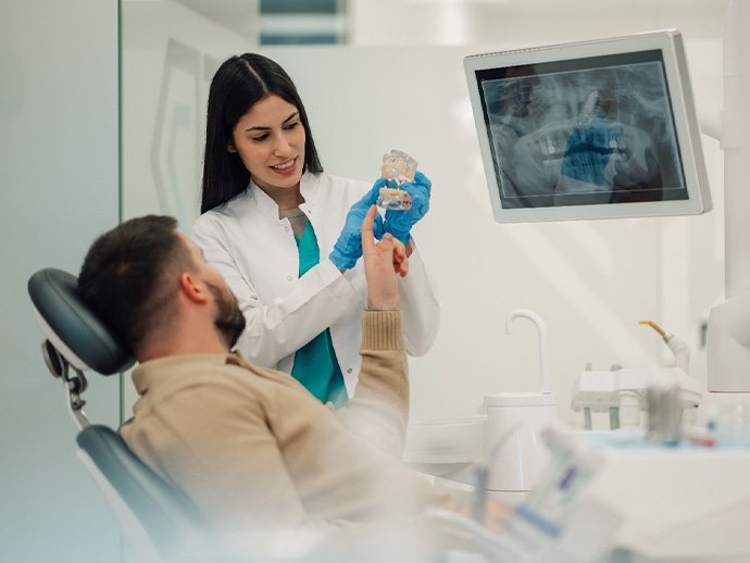 Dentist and patient discussing the cost of dental implants in Bethlehem 