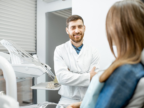 dentist talking to patient about dental implants in Thornville