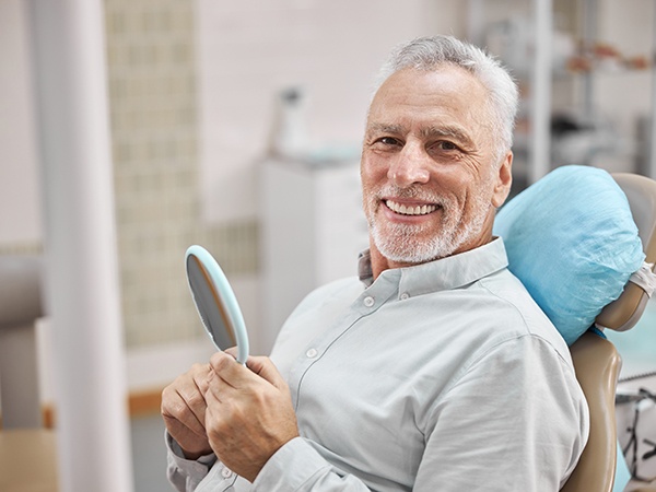 patient smiling after getting dental implants in Thornville