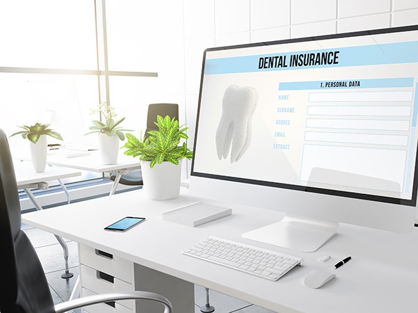 Dental insurance form on desktop in office