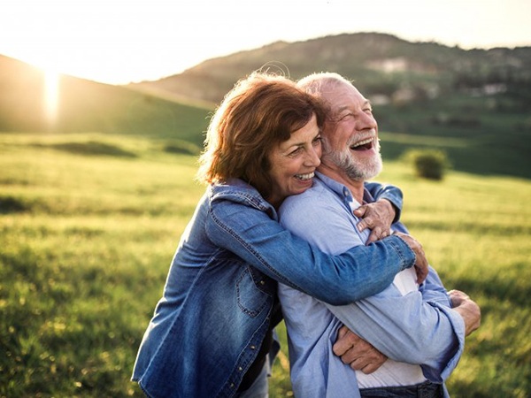 Couple embracing in a field