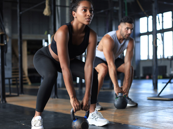 Man and woman working out in gym