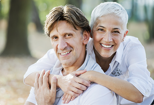 Senior couple smiling outdoors